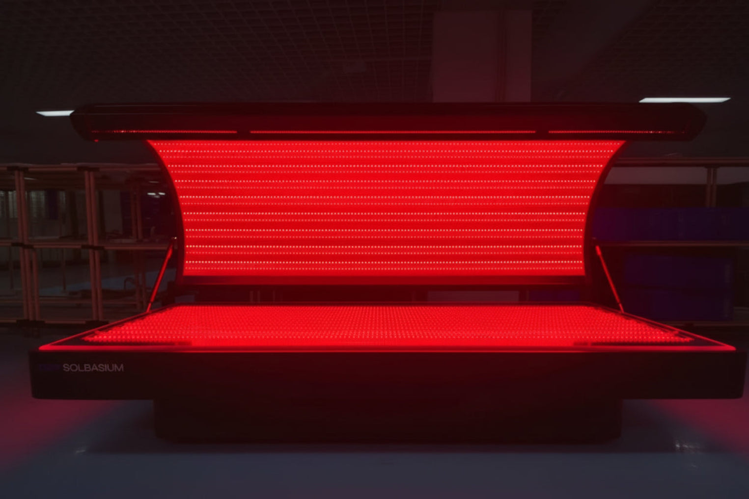 Red LED light therapy bed with visible red light inside view