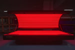 Red LED light therapy bed with visible red light inside view 