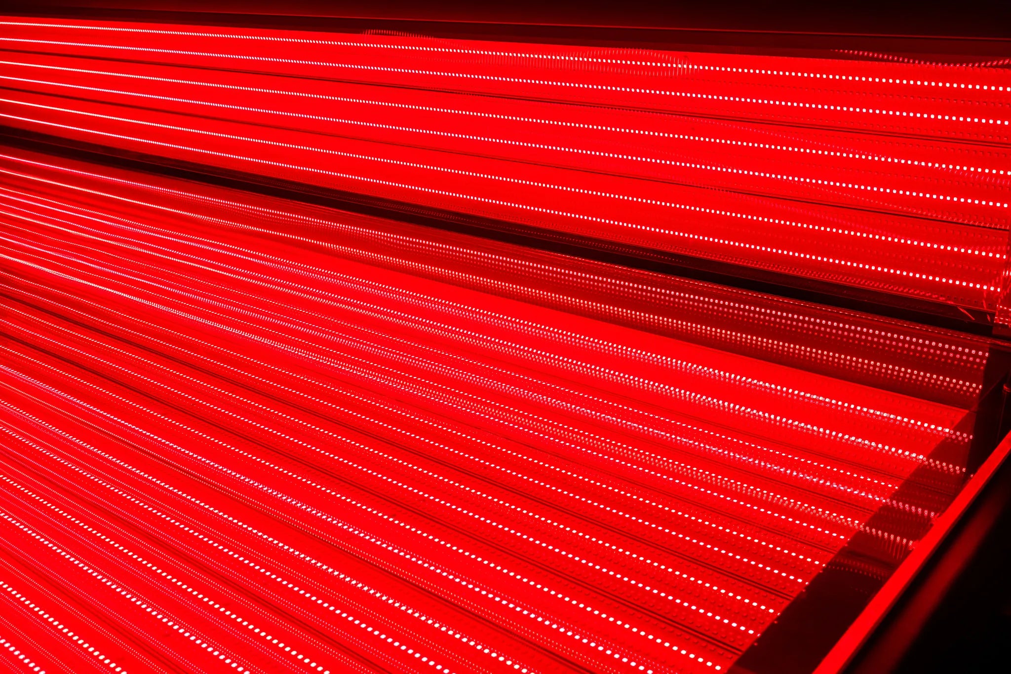 Close up of Helios Solbasium red light therapy LED panels inside the bed